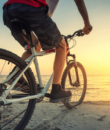 Cyclist at the beach