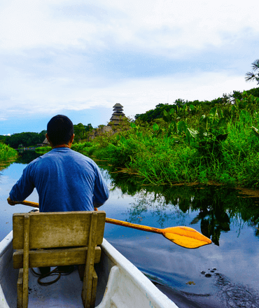 Man paddling through Amazon Jungle