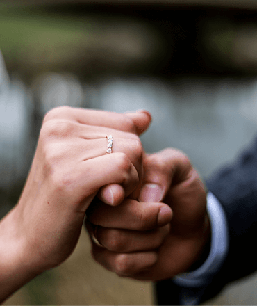 bride and groom holding hands