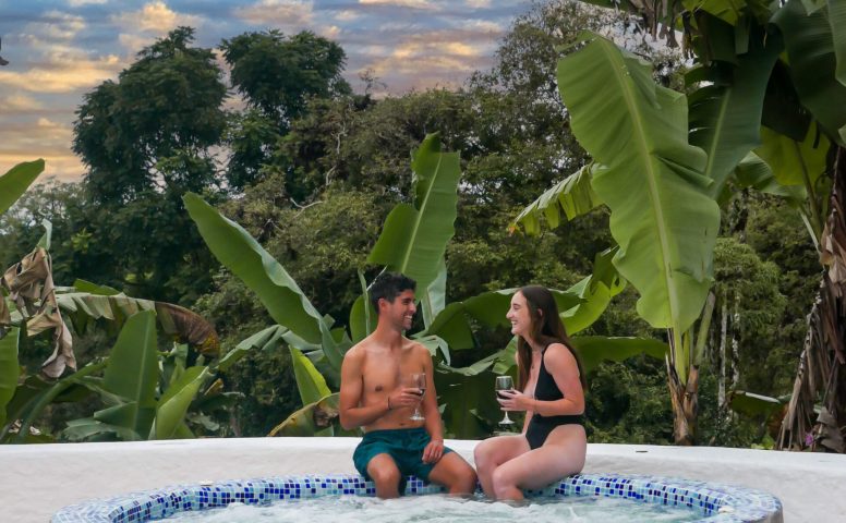 Couple sitting in hot tub